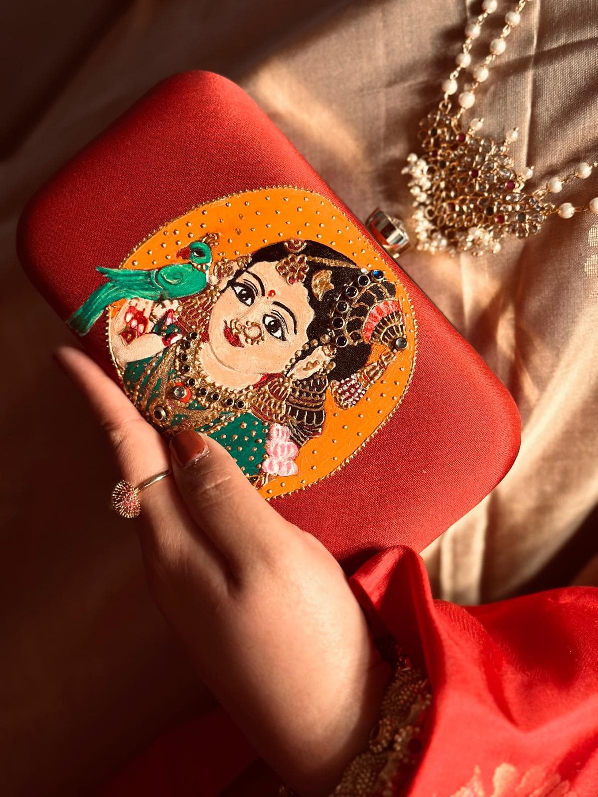 Hand-painted goddess clutch on coral silk